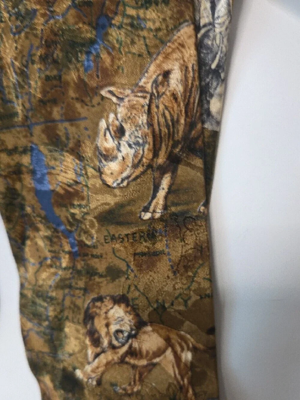 African Big 5 themed silk tie featuring an animal print pattern.